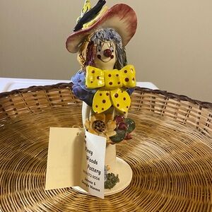 Piney words, pottery clown with basket of flowers, large bowtie